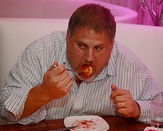 Katie Rickman | The Vindicator.Mike Vallas of Brothers in Food critiques the signature dishes at the CC Restaurant in Boardman, testing dishes like duck, PEI muscles, Ahi Tuna and much more one Thursday, Oct. 9, 2014.