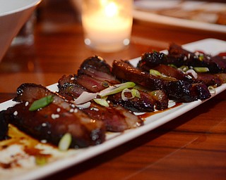 Katie Rickman | The Vindicator.Brothers in Food tasted signature dishes at the CC Restaurant in Boardman, testing dishes like duck, PEI muscles, Ahi Tuna and much more one Thursday, Oct. 9, 2014. Featured here is duck and is one of the signature dishes and is served with Udon noodles...the dish runs at $24.