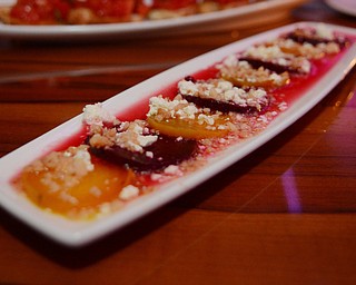 Katie Rickman | The Vindicator.Brothers in Food tasted signature dishes at the CC Restaurant in Boardman, testing dishes like duck, PEI muscles, Ahi Tuna and much more one Thursday, Oct. 9, 2014. Featured in photo is the small dish signature Blonde & Red Beets which features beets with Marcona almonds, Bulgarian fest and a zest orange vinaigrette and runs for $10.