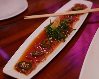 Katie Rickman | The Vindicator.Brothers in Food tasted signature dishes at the CC Restaurant in Boardman, testing dishes like duck, PEI muscles, Ahi Tuna and much more one Thursday, Oct. 9, 2014. Featured in photo is a signature dish of Ahi tuna.
