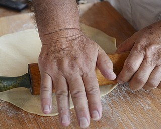 Katie Rickman | The Vindicator.Tad Siembida rolls fresh dough during the National Pierogi Day Celebration on Thursday, Oct. 9, 2014 at Martini Brothers Burger Bar.