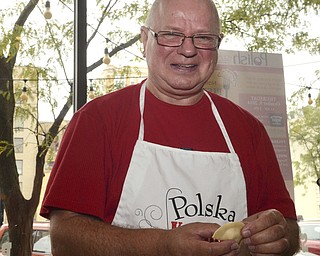 Katie Rickman | The Vindicator.Tad Siembida of Leetonia smiles as he makes pierogis during the National Pierogi Day Celebration on Thursday, Oct. 9, 2014.