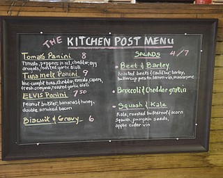 Katie Rickman | The Vindicator.The Kitchen Post menu shows the various foods offered at the new restaurant which is located in Friends Specialty downtown Youngstown on Thursday, Oct. 9, 2014.