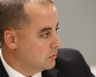        ROBERT K. YOSAY  | THE VINDICATOR..Marty Desmond Asst prosecutor - - Jeff  Solic  to his left  and Brian Goodin Chief Poland Twp  ( in uniform)..talk about the rash of burgularies recently and stopping them..-30-