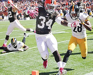 Browns rookie running back Isaiah Crowell heads into the end zone ahead of Steelers cornerback Cortez for a touchdown in the second quarter  of Sunday’s game at FirstEnergy Stadium in Cleveland. The Browns pulled off a rarity: a 31-10 rout of the Steelers, their biggest rivals.