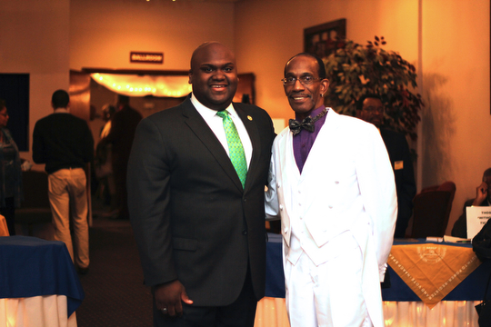 Steven Mickel (right) of the NAACP Youngstown chapter poses for a picture with Sammie Dow , National Youth and College Director of the NAACP, before the start of the NAACP banquit at the Mahoning Country Club in Liberty on Friday evening.  Dustin Livesay  |  The Vindicator  10/10/14  Mahoning Country Club