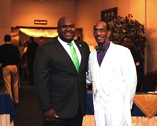 Steven Mickel (right) of the NAACP Youngstown chapter poses for a picture with Sammie Dow , National Youth and College Director of the NAACP, before the start of the NAACP banquit at the Mahoning Country Club in Liberty on Friday evening.  Dustin Livesay  |  The Vindicator  10/10/14  Mahoning Country Club