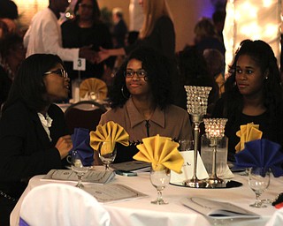 (L-R) Camille Bonner (16) of Cleveland, Danielle Harris (15) of Cleveland , and Kennedey Bell (17) of Hudson talk before the start of the NAACP banquit at the Mahoning Country Club in Liberty on Friday evening.  Dustin Livesay  |  The Vindicator  10/10/14  Mahoning Country Club