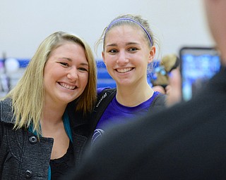 Jeff Lange | The Vindicator  Reserve senior Rachel Maslach (right) gets her picture taken with her sister Jessica Maslach after Western Reserve's victory, Thursday night at home. Rachel was recognized for her over 1,000 assists at last night's game.