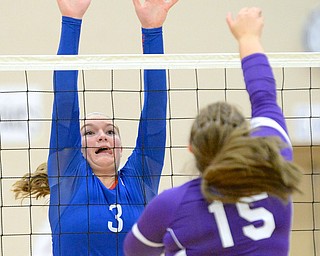 Jeff Lange | The Vindicator  Reserve senior Aleah Hughes (3) stretches out to defend Sebring's Megan McIlvain's spike early in Thursday night's matchup at Western Reserve High School.