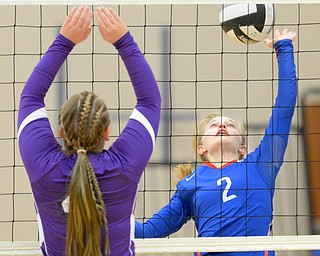 Jeff Lange | The Vindicator  Reserve's Sabrina Miller (2) looks up as she hits the ball over the net into the face of a Sebring player, Thursday night at Western Reserve.