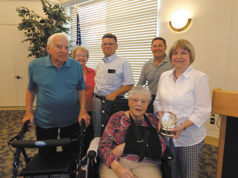 SPECIAL TO THE VINDICATOR
Friends of the Austintown Library honored Dorothy Fizet as one of the longest-term presidents in the group’s history. The Fizets and officers of the group follow. From left, standing are Tom Fizet, Judy Cebriak, Doug Wilcox, Gary Reel and Mary Ellen Wilcox. Dorothy Fizet is seated. Friends of the Austintown Library meets at 10 a.m. every fourth Monday in the community room of the Austintown branch of the public library. Meetings are open. The next meeting will feature Lori Stone, retired Air Force officer, with information for veterans.