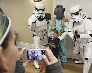 William D Lewis the Vinidcator Keeton Shaffer,4, poses with Star Wars characters as his mother Haley Shaffer, left, makes a photo during a star wars themed event Saturday 10-1-14 at the Poland Library.