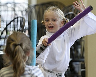 William D Lewis the Vinidcator  Lila Gordon, 6, left of Poland and Alex Taylor, 6, of Struthers dressed in a Princecess Leia costume during a star wars thmed event Saturday 10-1-14 at the Poland Library.