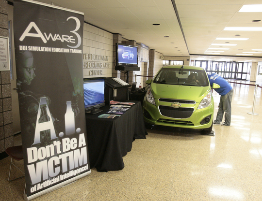        ROBERT K. YOSAY  | THE VINDICATOR..State Farm brought in a car courtesy of Sweeney Chevrolet -  to Boardman  high school so that students can do demos of different driving scenarios. Supposed to teach driving safety, such as not to text and drive. etc.....-30-