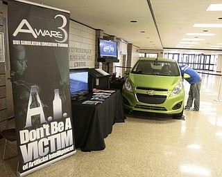       ROBERT K. YOSAY  | THE VINDICATOR..State Farm brought in a car courtesy of Sweeney Chevrolet -  to Boardman  high school so that students can do demos of different driving scenarios. Supposed to teach driving safety, such as not to text and drive. etc.....-30-