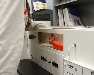        ROBERT K. YOSAY  | THE VINDICATOR..Gillian Pirone  8th grade (ok)  checks the aerodynamics of a car in a wind tunnel apparatus...   STEM students use computers, drawing programs, and study aerodynamics as part of the STEM program. ..-30-