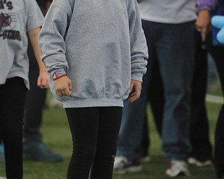 Delanie Olesh (7) of Youngstown jumps in the air to warm up before the start of the Walk to End Alzheimers on Saturday morning at the Watson and Tressel Training Site.   Dustin Livesay  |  The Vindicator  10/11/14  WATTS, YSU