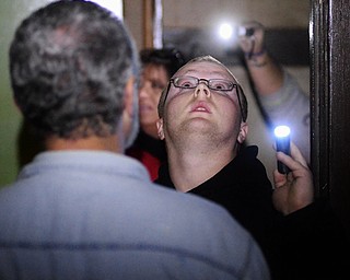 Jeff Lange | The Vindicator  Jonathan Brasier of Farrell PA looks around the haunted J.C. Thompson Building, Saturday Oct. 11th in East Liverpool during a Dark Shadow Ghost Tour.