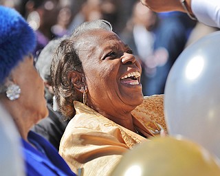Jeff Lange | The Vindicator  67 year member of Tabernacle Baptist Church, Carolyn A. Harris shares a moment with other honorees as they receive balloons, Sunday after service during the street dedication.
