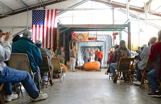 Jeff Lange | The Vindicator  The audience claps after a pumpkin weighs in at 510 pounds, Saturday morning during the 20th annual Giant Pumpkin Weigh-Off at Parks Garden Center in Green.