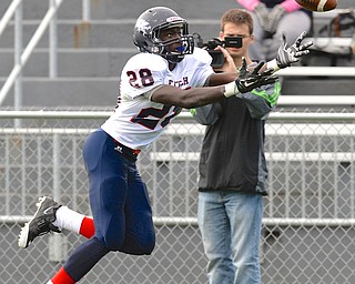Jeff Lange | The Vindicator  Fitch's Earl Scott lunges forward in attempt to catch an end zone pass during first half action against the East Panthers at Rayen Stadium.