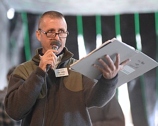 Jeff Lange | The Vindicator  Contest director Tim Parks announces pumpkins during weigh ins at Parks Garden Center, Saturday morning at the 20th annual Giant Pumpkin Weigh-Off.