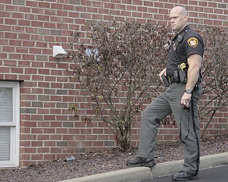        ROBERT K. YOSAY  | THE VINDICATOR..The Youngstown Police Dept  bomb squad set off what appeared to be a pipe bomb outside a broken window at the Betras, Harshman and Kopp law office in Canfield on Seville Dr...that ended up not being explosive....-30-
