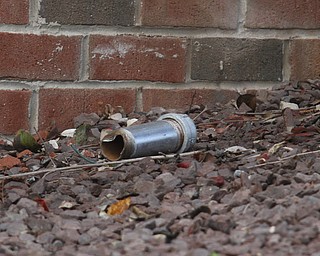        ROBERT K. YOSAY  | THE VINDICATOR..The Youngstown Police Dept  bomb squad set off what appeared to be a pipe bomb outside a broken window at the Betras, Harshman and Kopp law office in Canfield on Seville Dr...that ended up not being explosive....-30-