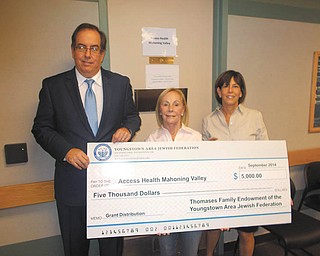 SPECIAL TO THE VINDICATOR Access Health Mahoning Valley accepted a grant of $5,000 from the Thomases Family Endowment through the Youngstown Area Jewish Federation. The grant will be used by Access to provide information and referral services for low income, uninsured adults in Mahoning and Trumbull counties to access no- or low-cost medical, dental or vision care. From left to right are Bill Adams, director of Access; Jeanne Fibus, member of the Thomases Family Endowment Distribution committee; and Deborah Grinstein, endowment director for the Jewish Federation.