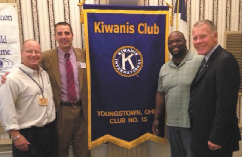SPECIAL TO THE VINDICATOR Kiwanis Club of Youngstown welcomed Judge Robert N. Rusu Jr., Mahoning County Probate Court, who was the speaker at the club’s Sept. 19 meeting at the downtown YMCA. Rusu has been a probate/elder law attorney for more than 20 years and was co-owner and partner of Lane & Rusu Co. L.P.A. in Canfield. He is a graduate of Youngstown State University and earned his law degree from the Thomas M. Cooley Law School in 1993. He was admitted to the bar on Nov. 8, 1993. From left are Rob Gardner, Kiwanis president-elect; Rusu; Brad Harris, club president; and Chris McCarty, Kiwanis Division 21 lieutenant governor.