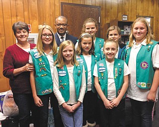 SPECIAL TO THE VINDICATOR Howland Girl Scouts Troop 554 donated much-needed items to the Christy House Emergency Shelter. They raised the money for the items through a garage sale. The project was the bronze award, the highest achievement a Junior Girl Scout can earn. In the front row, from left, are Beth Latimer, manager of Christy House; Scouts Elizabeth Potts, Haylee Adgate, Haylee Lawson, Destiny Ross and Halee Hall. In the back row are Thomas Conley, Christy House president and CEO; and Scouts Kaitlyn James and Madison James.