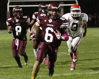  .          ROBERT  K. YOSAY | THE VINDICATOR..Girard at Liberty as Liberty ..Libertys #6 Lynn Bowden has a clear field as  #3 for Girard Kenny Griffin can only watch as he heads for the endzone  Watching #8 Liberty Alex Carnathan..-30-