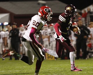  .          ROBERT  K. YOSAY | THE VINDICATOR..Girard at Liberty as Liberty ..#3 Libertys Michael Rushton heads for a Touch down after cutting around end and  Girards #20 Chaston Williams gave chase - first quarter action..-30-