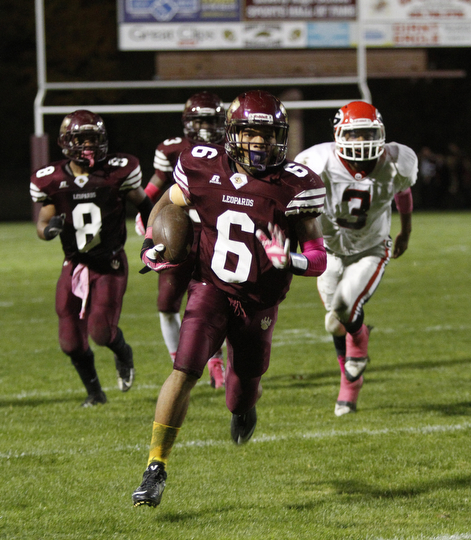 ROBERT  K. YOSAY | THE VINDICATOR.Girard at Liberty as Liberty ..Libertys #6 Lynn Bowden has a clear field as  #3 for Girard Kenny Griffin can only watch as he heads for the endzone  Watching #8 Liberty Alex Carnathan
