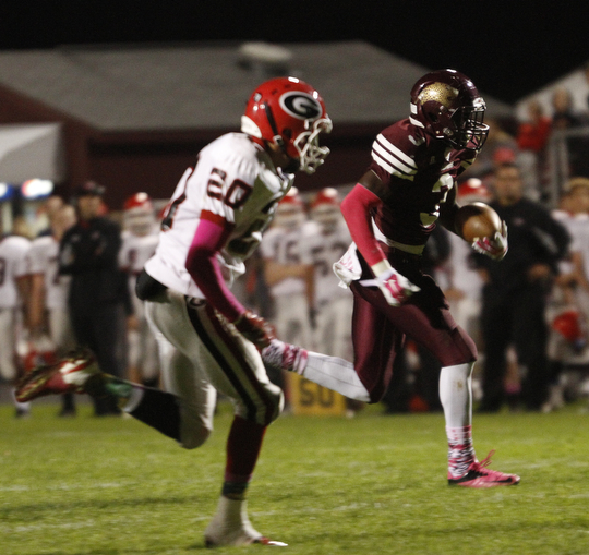 ROBERT  K. YOSAY | THE VINDICATOR.Girard at Liberty as Liberty ..#3 Libertys Michael Rushton heads for a Touch down after cutting around end and  Girards #20 Chaston Williams gave chase - first quarter action.