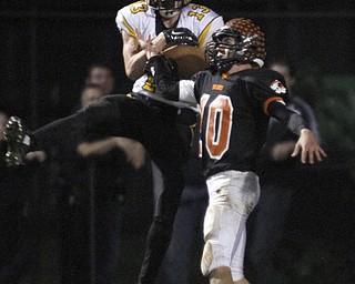  .          ROBERT  K. YOSAY | THE VINDICATOR..Crestview at Springfield as#13 Crestview  Evan Beachler hauls in a pass as #10 Springfield Graham Mincher tries to defend.. this play was calle dback for roughing  the passer ....-30-