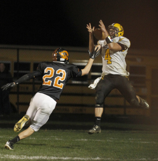 ROBERT  K. YOSAY | THE VINDICATOR.Crestview at Springfield as #4  Tyler Stratton has the ball batted away by #22 Nate Simboli .. play was called back on a penalty