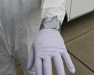        ROBERT K. YOSAY  | THE VINDICATOR...Seth Durig of Lane Life-Trans  - shows off a level C containment suit.  typically worn - for treating infected people ..-30-