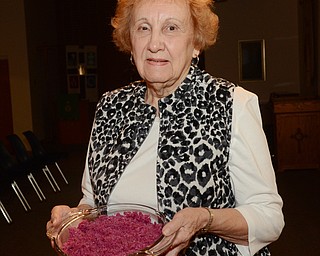 Katie Rickman | The Vindicator.Alice Hartig holds a dish of “red cabbage” that she will make for the annual international dinner at Bethel Lutheran Church that will be held at the church on Oct. 25, 2014. The dinner will feature food from several cultures.