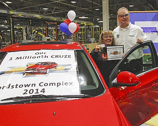        ROBERT K. YOSAY  | THE VINDICATOR..Sharon Frey of Mineral RIdge.. holds the certificate that the car is the 1 millionith Cruze built shortly after she won the cruze in a drawing with her is Glenn Johnson UAW 1112..UAW Locals 1112 and 1714 purchased the one millionith Cruze  that was  raffled to a Lordstown UAW team member. (Sharon Frey of Mineral Ridge.- Raffle proceeds beyond the cost of the Cruze were donated to the St. Vincent DePaul Society of Youngstown. US REp Sherrod Brown will drew the winning name. ..-30-
