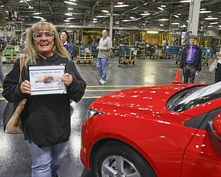        ROBERT K. YOSAY  | THE VINDICATOR..Sharon Frey of Mineral RIdge.. holds the certificate that the car is the 1 millionith Cruze built shortly after she won the cruze in a drawing..UAW Locals 1112 and 1714 purchased the one millionith Cruze  that was  raffled to a Lordstown UAW team member. (Sharon Frey of Mineral Ridge.- Raffle proceeds beyond the cost of the Cruze were donated to the St. Vincent DePaul Society of Youngstown. US REp Sherrod Brown will drew the winning name. ..-30-