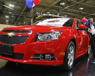        ROBERT K. YOSAY  | THE VINDICATOR..US rep Sherrod Brown - leans against the 1 millionith Cruze..UAW Locals 1112 and 1714 purchased the one millionith Cruze  that was  raffled to a Lordstown UAW team member. (Sharon Frey of Mineral Ridge.- Raffle proceeds beyond the cost of the Cruze were donated to the St. Vincent DePaul Society of Youngstown. US REp Sherrod Brown will drew the winning name. ..-30-