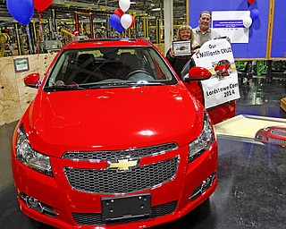        ROBERT K. YOSAY  | THE VINDICATOR..Sharon Frey of Mineral RIdge.. holds the certificate that the car is the 1 millionith Cruze built shortly after she won the cruze in a drawing with her is Glenn Johnson UAW 1112..UAW Locals 1112 and 1714 purchased the one millionith Cruze  that was  raffled to a Lordstown UAW team member. (Sharon Frey of Mineral Ridge.- Raffle proceeds beyond the cost of the Cruze were donated to the St. Vincent DePaul Society of Youngstown. US REp Sherrod Brown will drew the winning name. ..-30-