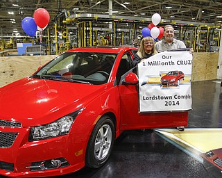        ROBERT K. YOSAY  | THE VINDICATOR..Sharon Frey of Mineral RIdge.. holds the certificate that the car is the 1 millionith Cruze built shortly after she won the cruze in a drawing with her is Glenn Johnson UAW 1112..UAW Locals 1112 and 1714 purchased the one millionith Cruze  that was  raffled to a Lordstown UAW team member. (Sharon Frey of Mineral Ridge.- Raffle proceeds beyond the cost of the Cruze were donated to the St. Vincent DePaul Society of Youngstown. US REp Sherrod Brown will drew the winning name. ..-30-