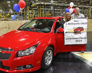        ROBERT K. YOSAY  | THE VINDICATOR..Sharon Frey of Mineral RIdge.. holds the certificate that the car is the 1 millionith Cruze built shortly after she won the cruze in a drawing with her is Glenn Johnson UAW 1112..UAW Locals 1112 and 1714 purchased the one millionith Cruze  that was  raffled to a Lordstown UAW team member. (Sharon Frey of Mineral Ridge.- Raffle proceeds beyond the cost of the Cruze were donated to the St. Vincent DePaul Society of Youngstown. US REp Sherrod Brown will drew the winning name. ..-30-