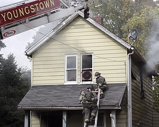       ROBERT K. YOSAY  | THE VINDICATOR..a fire on butler ave in Youngstown reportedly started in a kitche.. had Youngstown fire crews busy wednesday afternoon....-30-