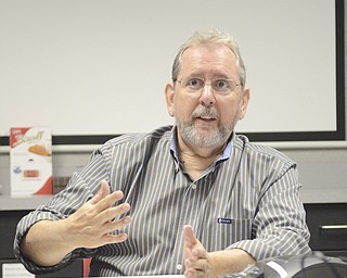 Katie Rickman | The Vindicator.Chuck Cooper a manager of Technical and Marketing Communictions with altronic Hoerbiger Engine Solutions in Girard discusses the role that altronic plays in the overall gas production on Thursday, Oct. 16, 2014.