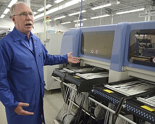 Katie Rickman | The Vindicator.Doug Cirbus, Vice President of Operations at altronic Hoerbiger Engine Solutions shows machinery used in the process of manufacturing components used in GTI Bi-fuel system which is made at the Girard facility.