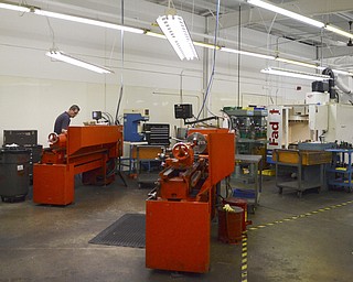 Katie Rickman | The Vindicator.Employees at the Altronic facilty in Girard work in the shop on Thursday, Oct. 16, 2014.